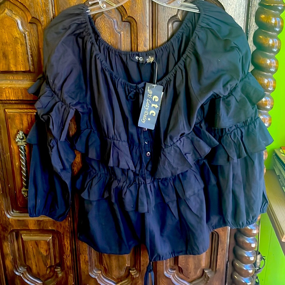 New with tags!! Beautiful black blouse